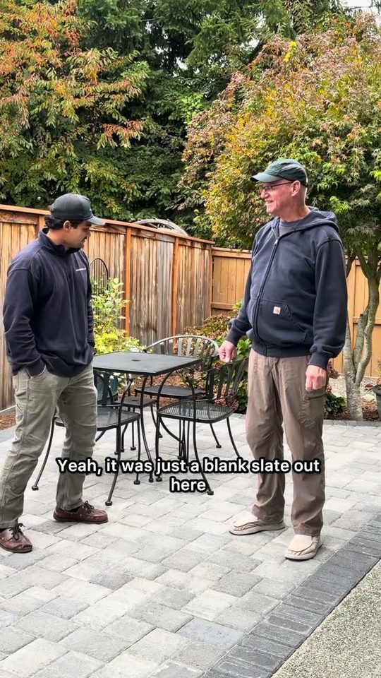 Homeowner talking on his new paver patio